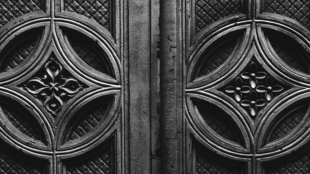 grayscale photo of wooden door