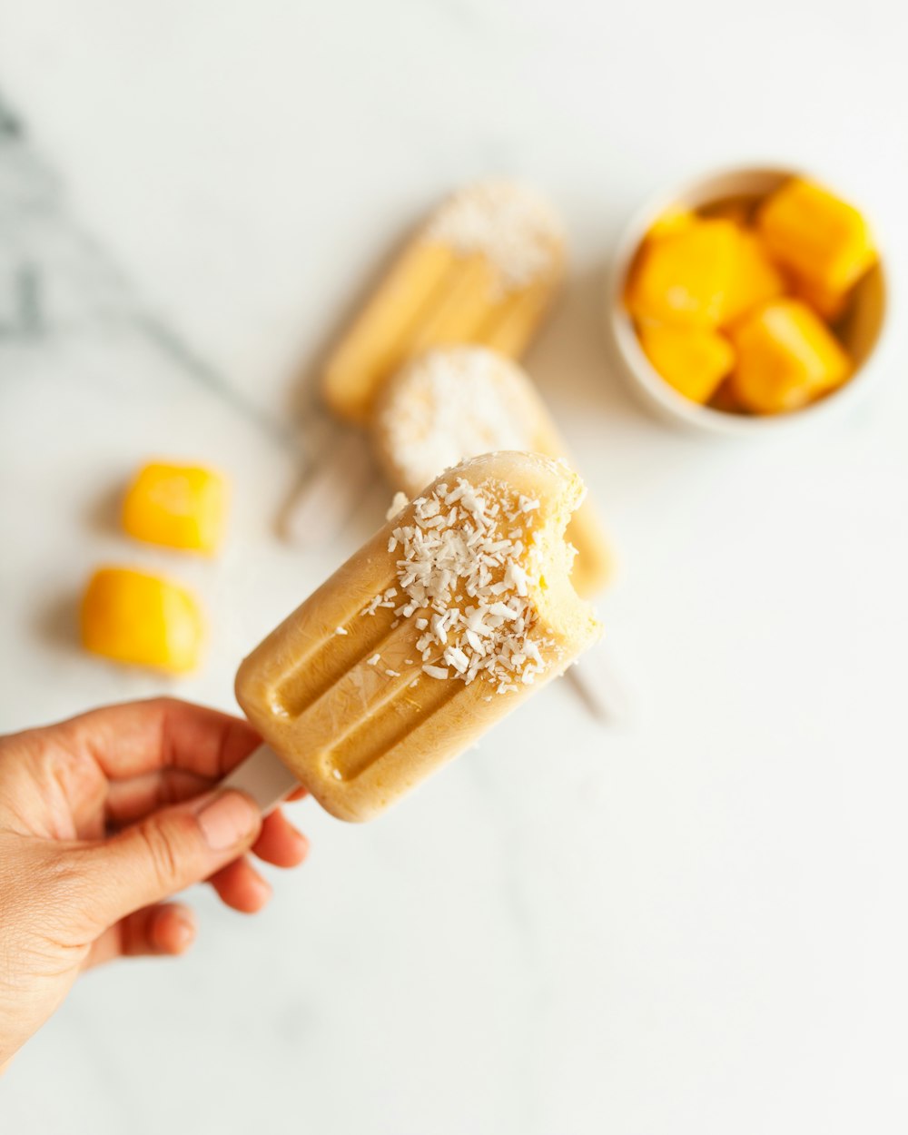 person holding brown and white food