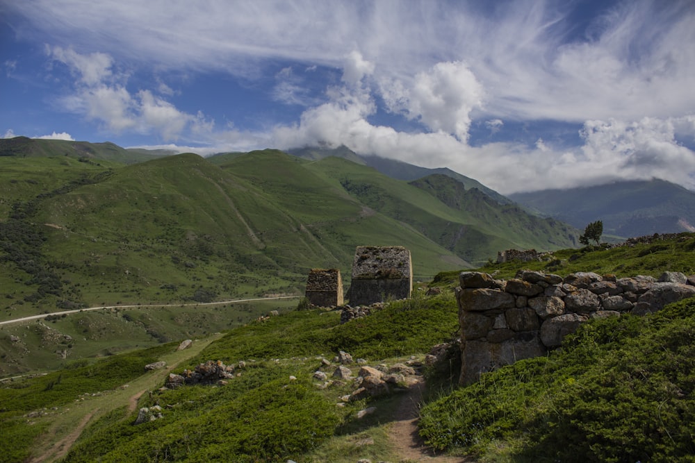 green mountain under white clouds during daytime