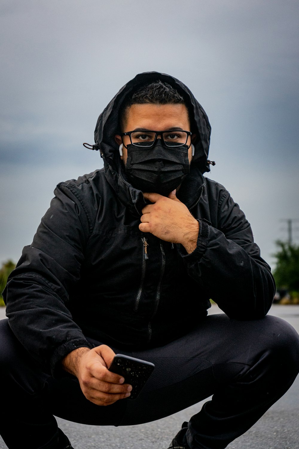 man in black leather jacket wearing black sunglasses