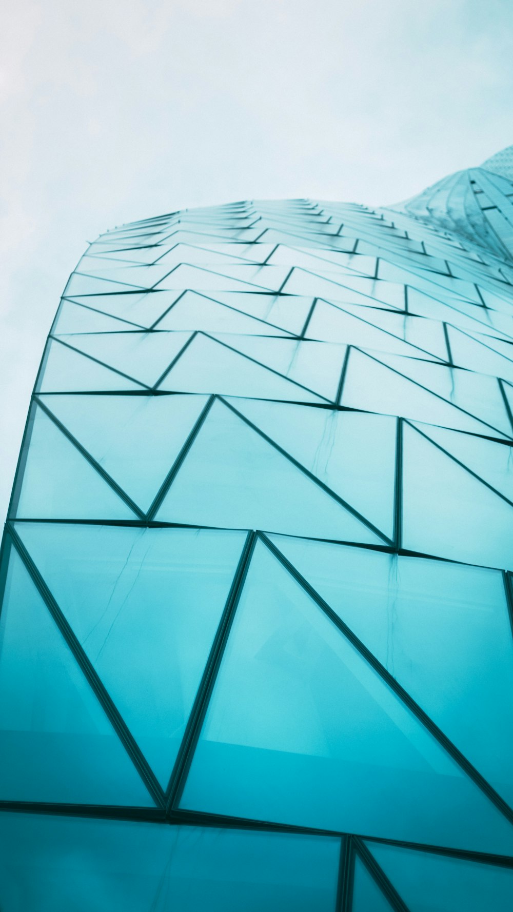 a very tall building with a sky background