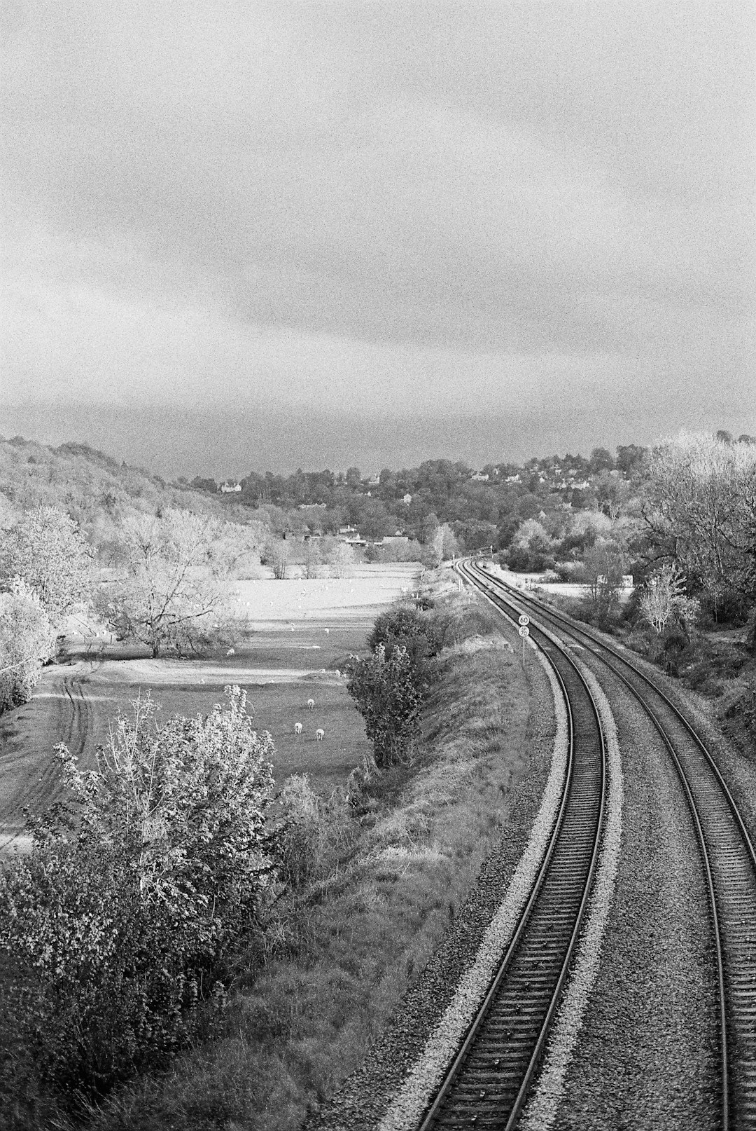 grayscale photo of train rail