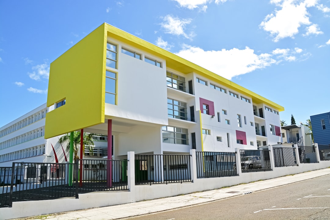 white and blue concrete building under blue sky during daytime