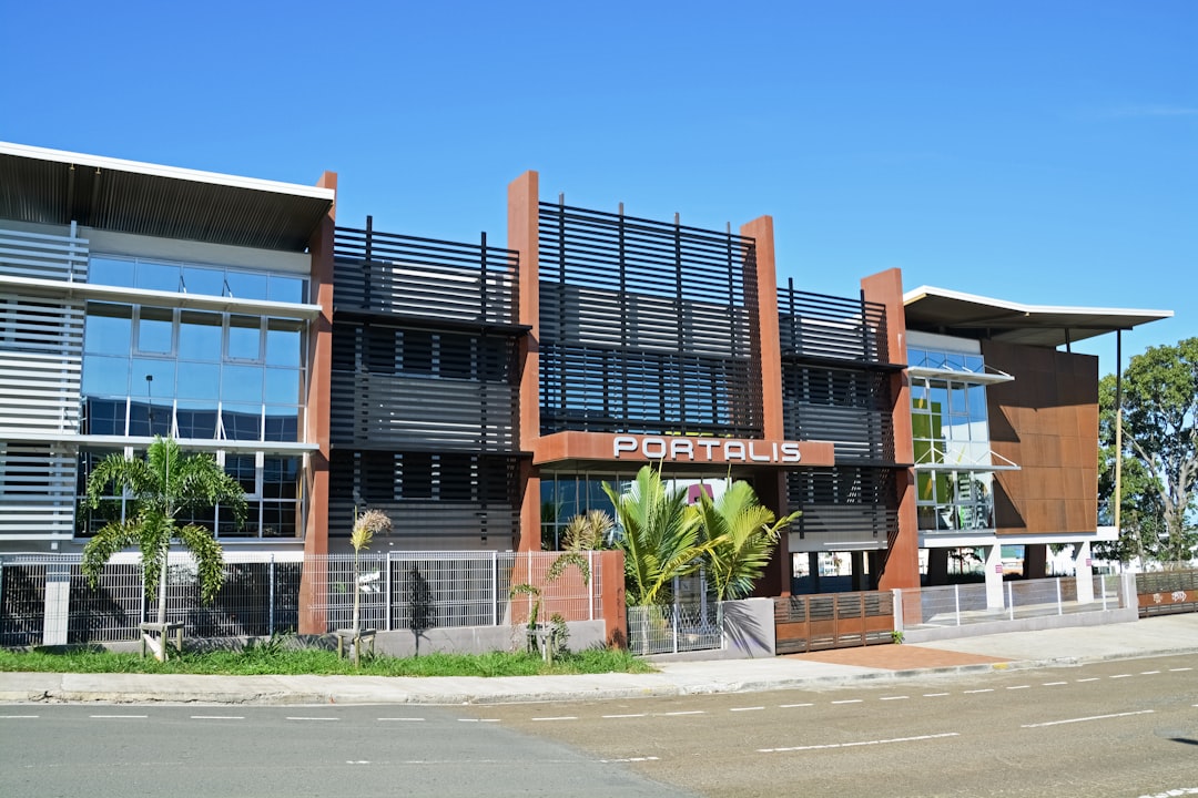 brown and white concrete building under blue sky during daytime