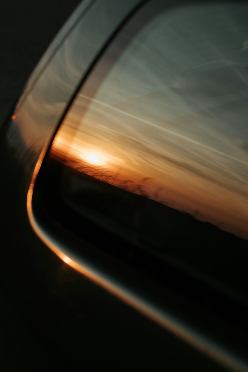 car side mirror during sunset