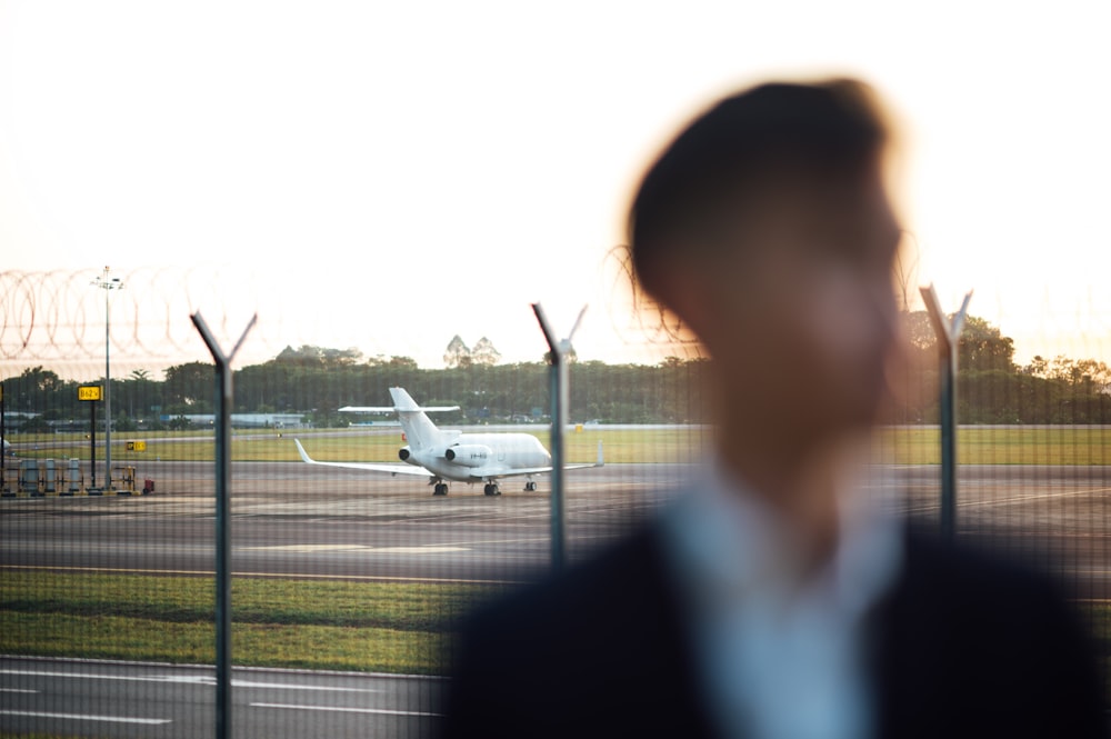 white airplane on airport during daytime