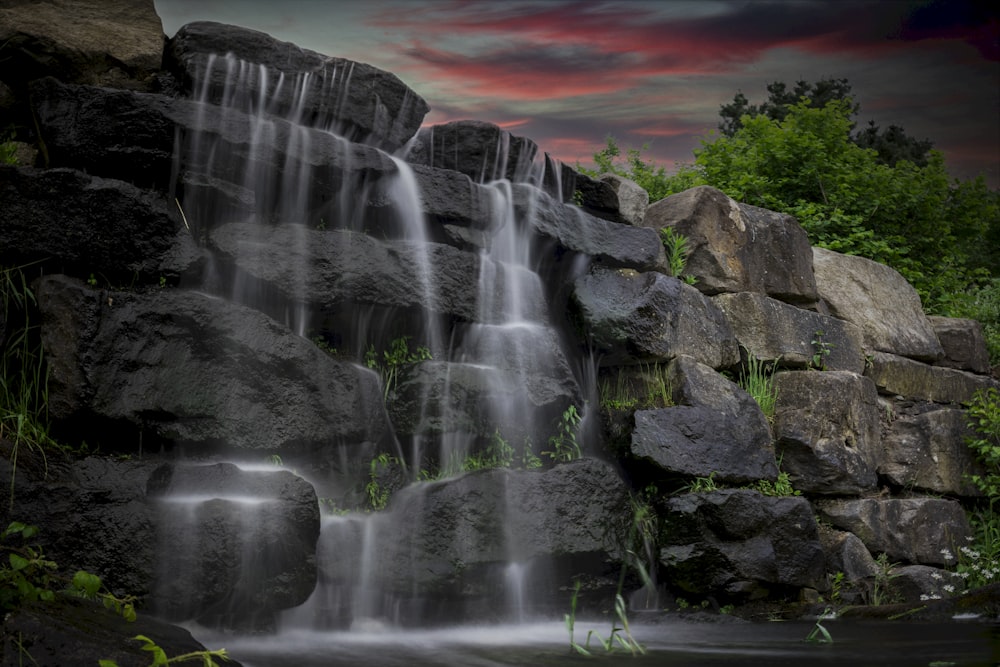 water falls on rocky mountain