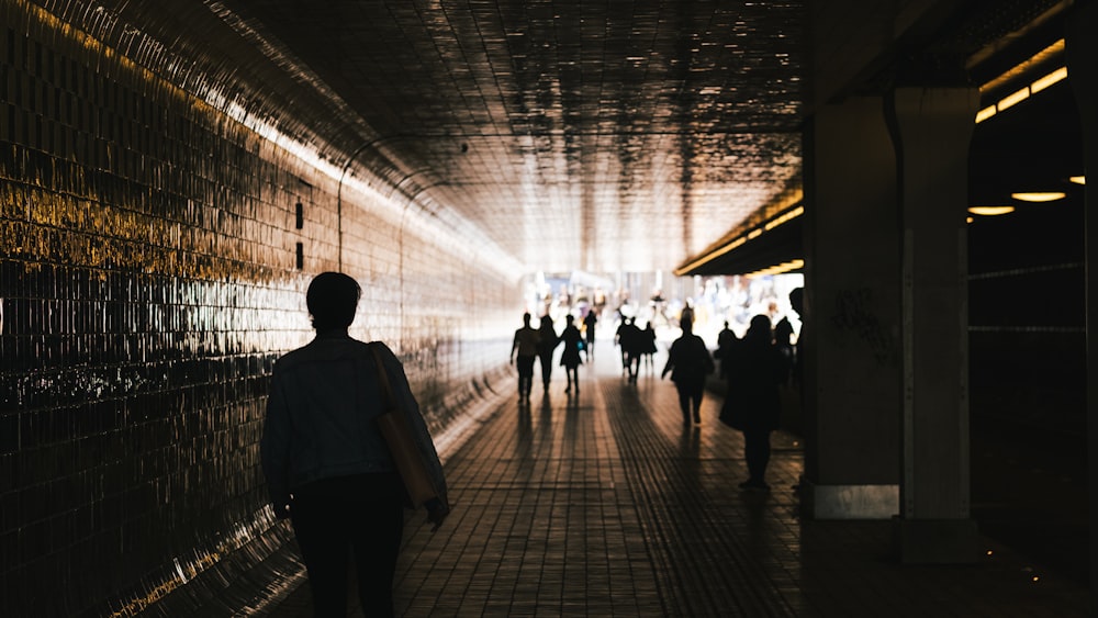 people walking on a hallway