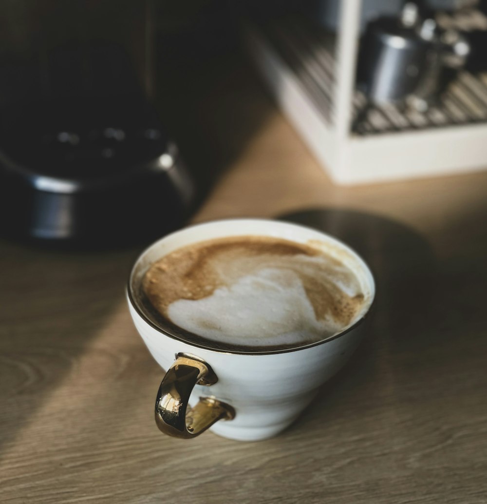 white ceramic mug with coffee