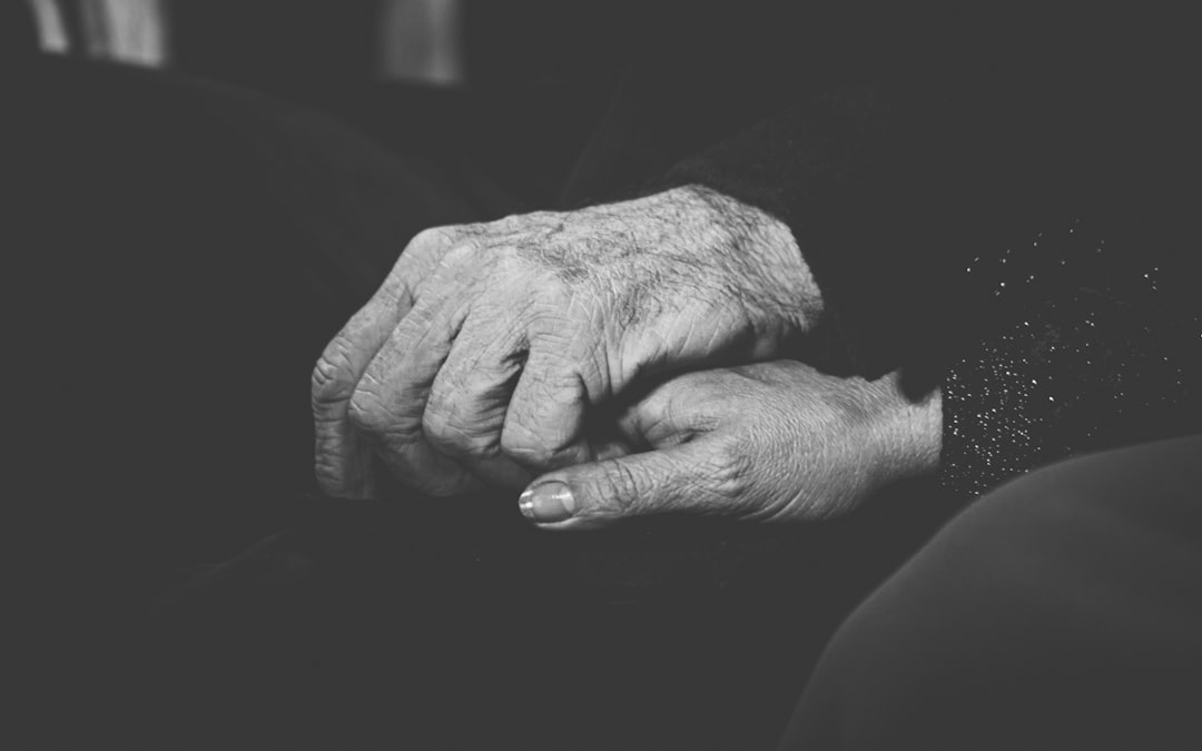 grayscale photo of persons hand