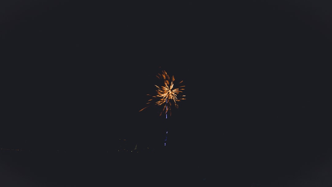 yellow fireworks in the sky during night time
