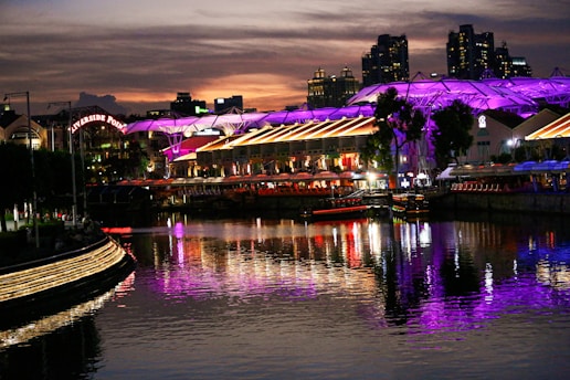 A vibrant photo of the Riverside skyline with a British flag gently waving in the foreground.