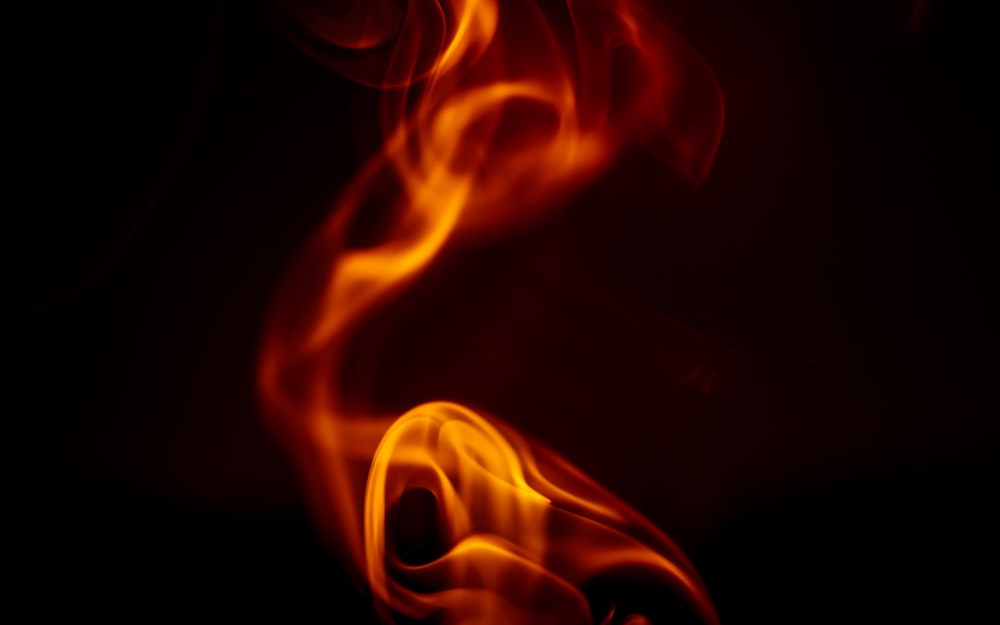 a close up of a fire on a black background