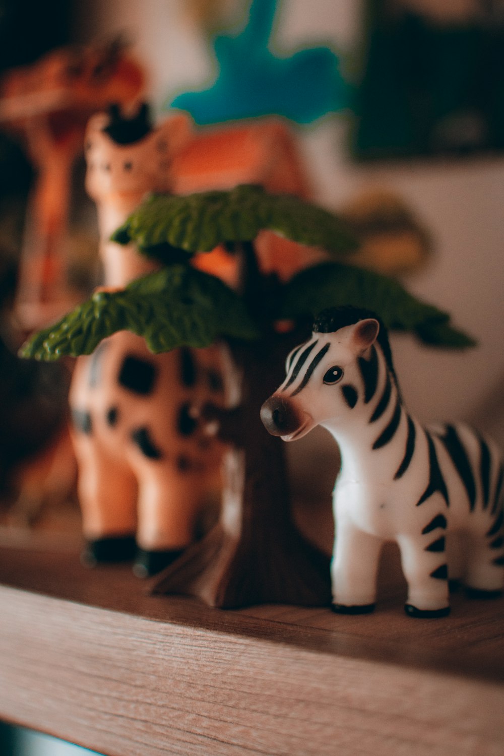 a close up of a toy zebra on a shelf