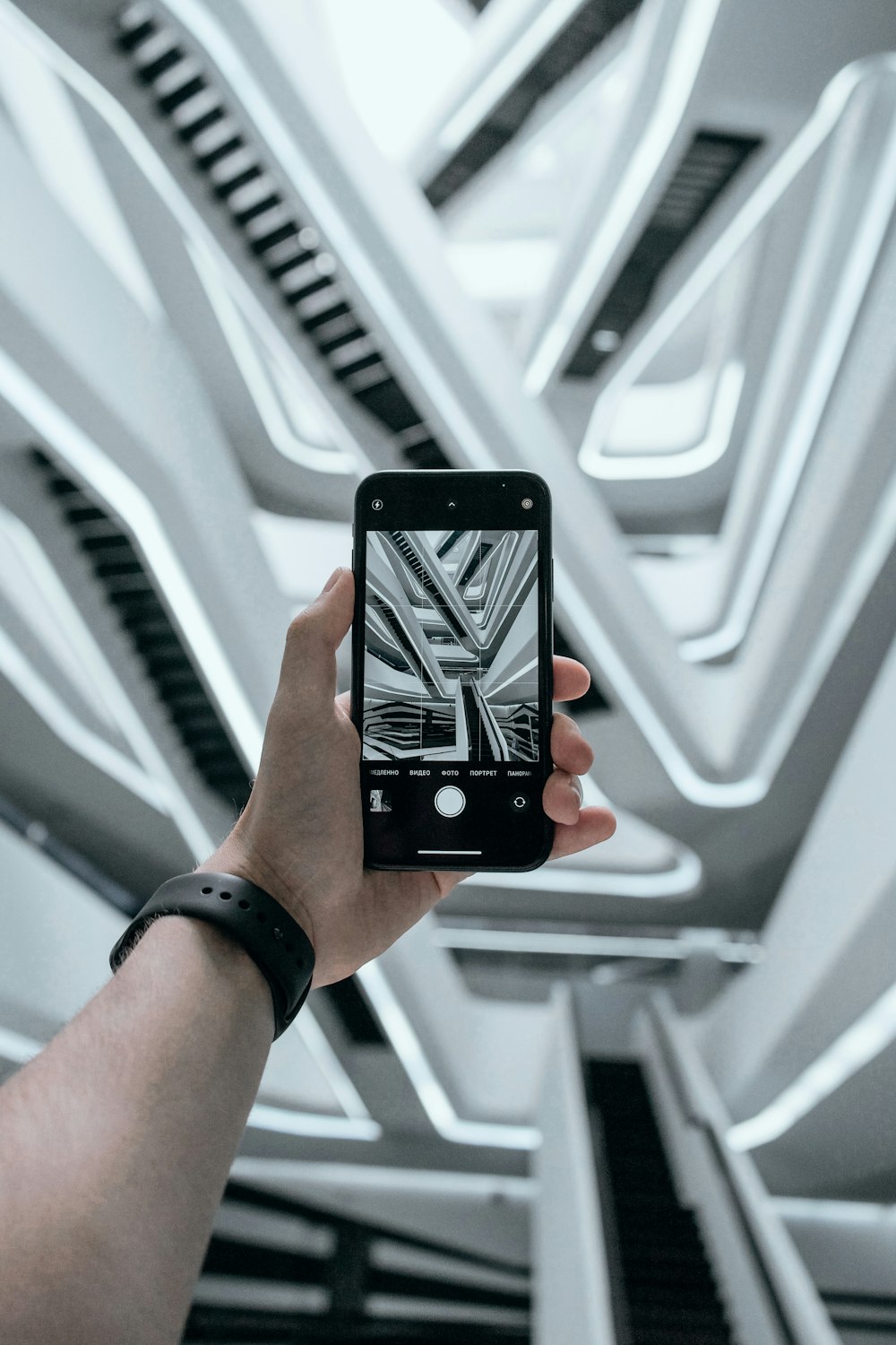 person holding black iphone 4