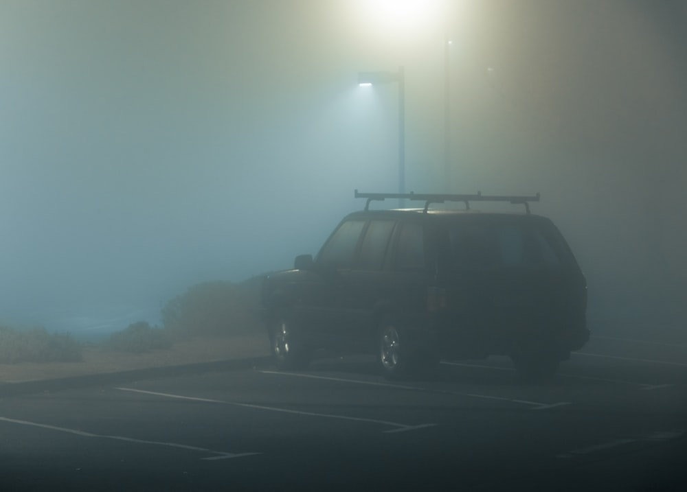 black suv on road during daytime