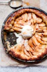 brown and white pastry on black round plate