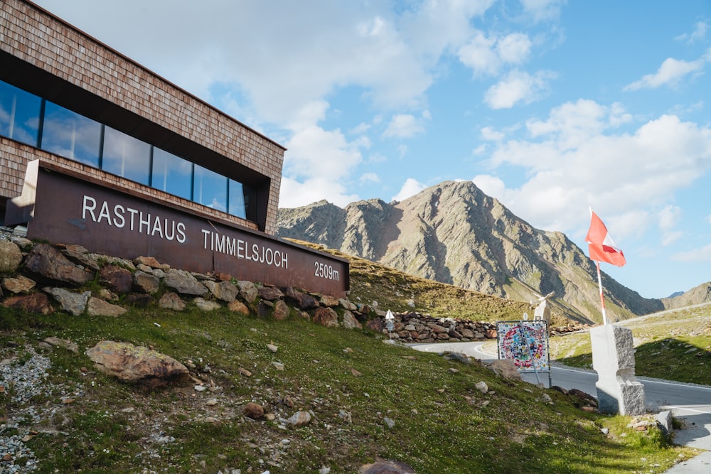 brown and white concrete building near mountain under blue sky during daytime