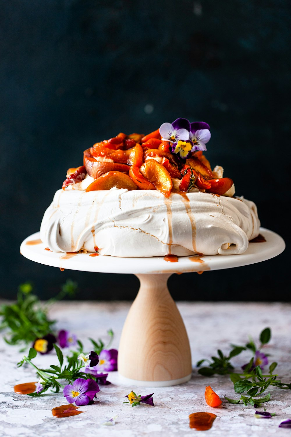 white ceramic plate with brown and white cake