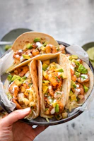 brown and green vegetable salad on brown paper bag