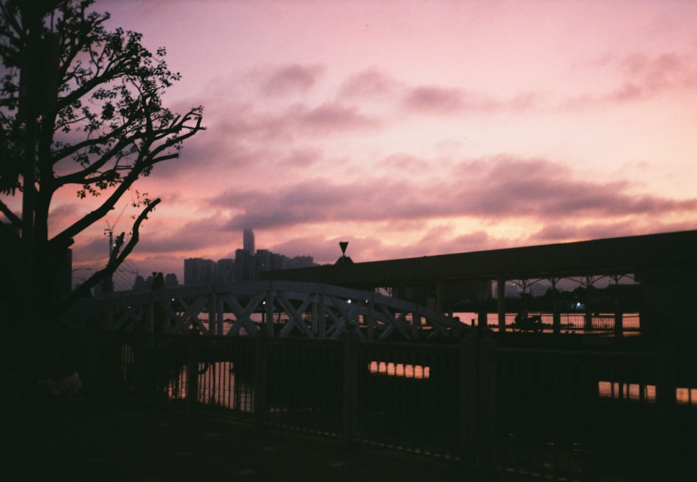 black bridge under gray clouds