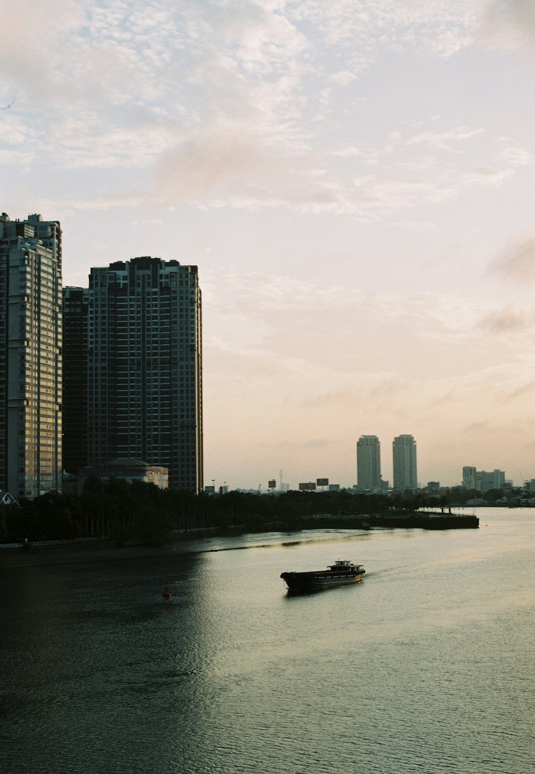 body of water near city buildings during daytime