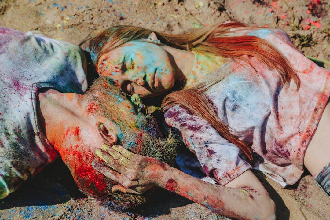 woman in white and red dress lying on ground