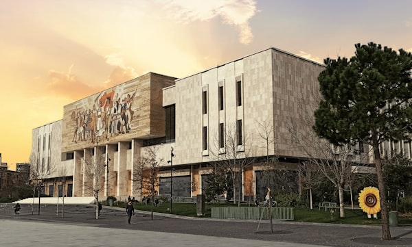 National History Museum with its socialist-era mosaic facade at sunset, Tirana