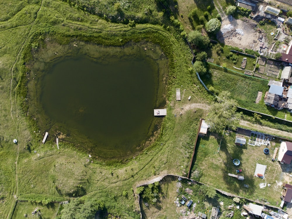 aerial view of green grass field and river