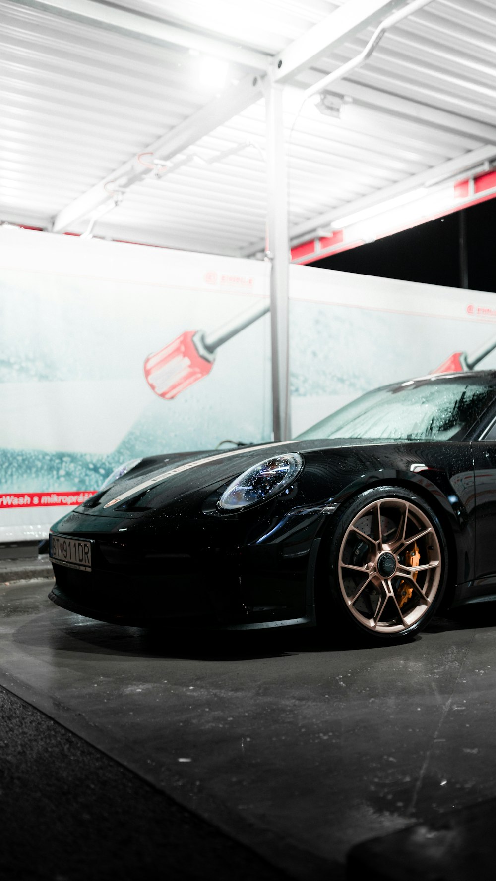 black porsche 911 parked in garage