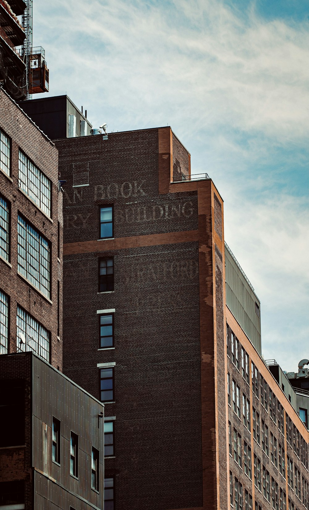 brown concrete building under blue sky during daytime