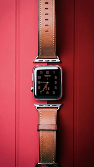 Elegant smartwatch with a classic round face and leather band, perfect for formal wear.