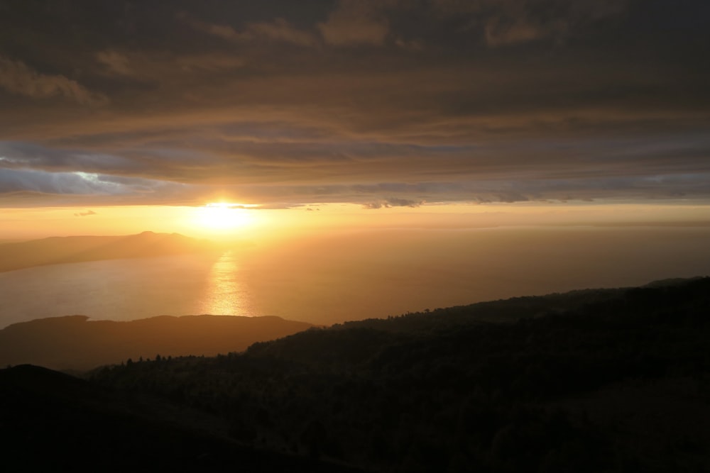 silhouette of mountains during sunset