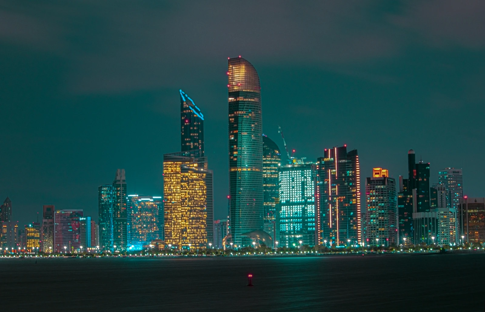 Abu Dhabi skyline at night from the Corniche Breakwater