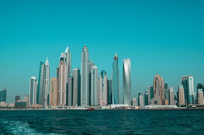city skyline across body of water during daytime