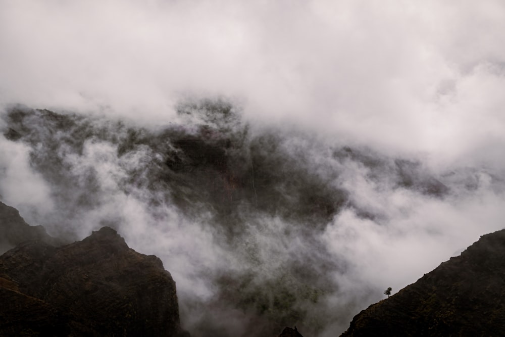 black and white mountain with clouds