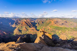 green and brown mountain under blue sky during daytime