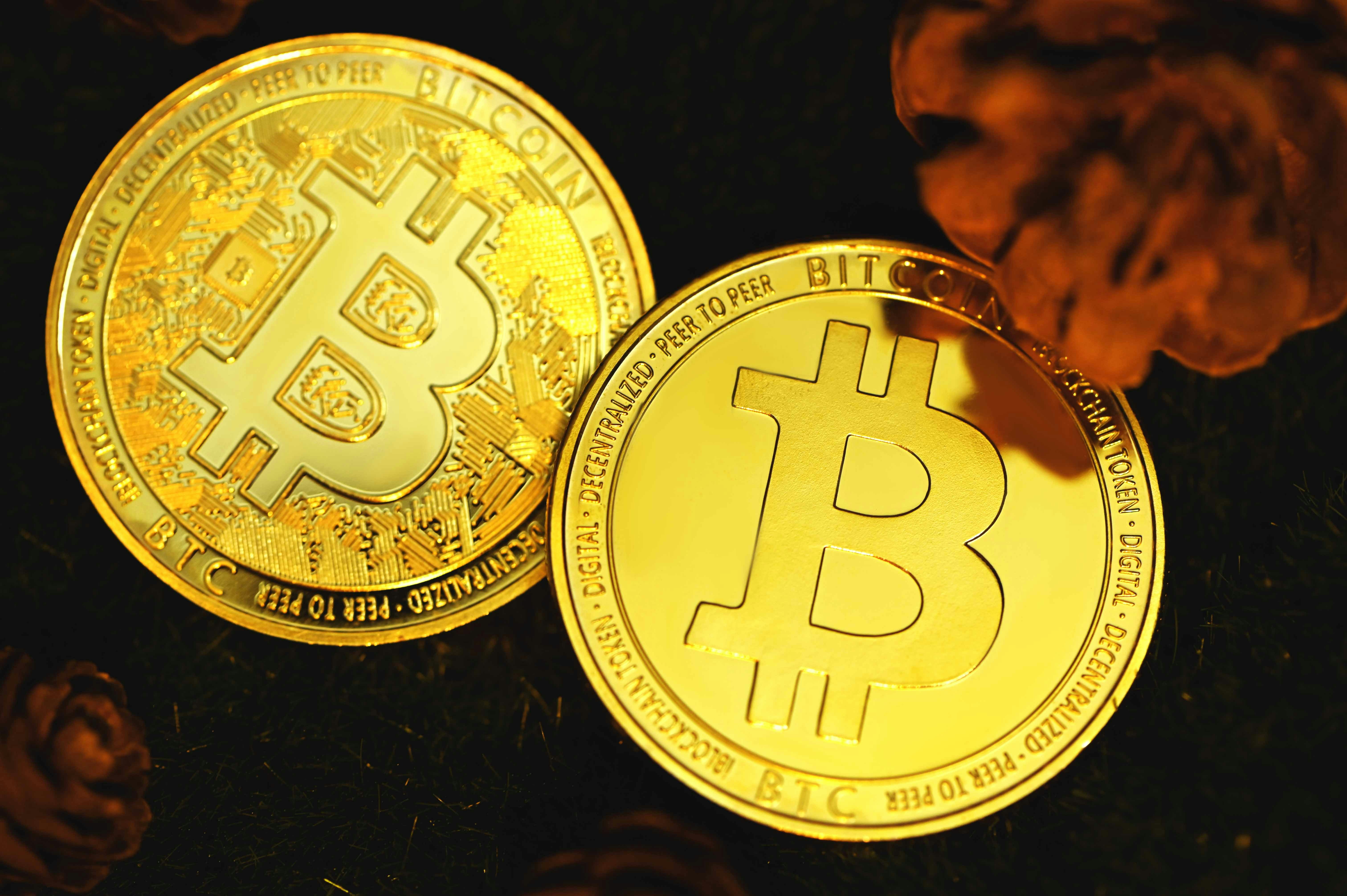 gold round coin on black textile