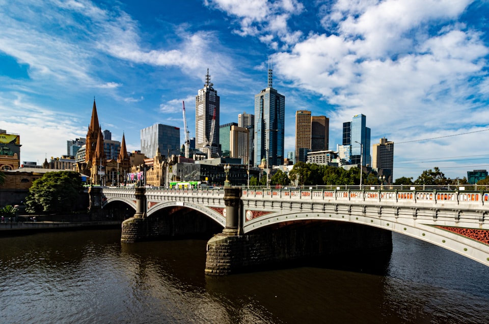 Melbourne skyscrapers in the background and the Yarra River in the foreground.
