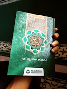 A compact pocket-sized Quran for easy carrying.