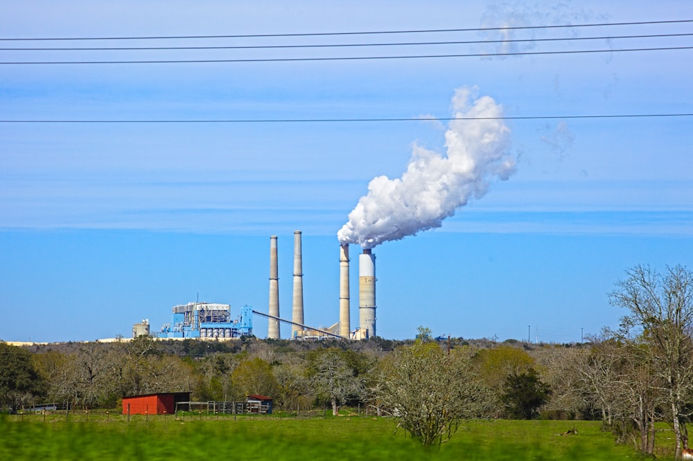 white smoke coming out from factory