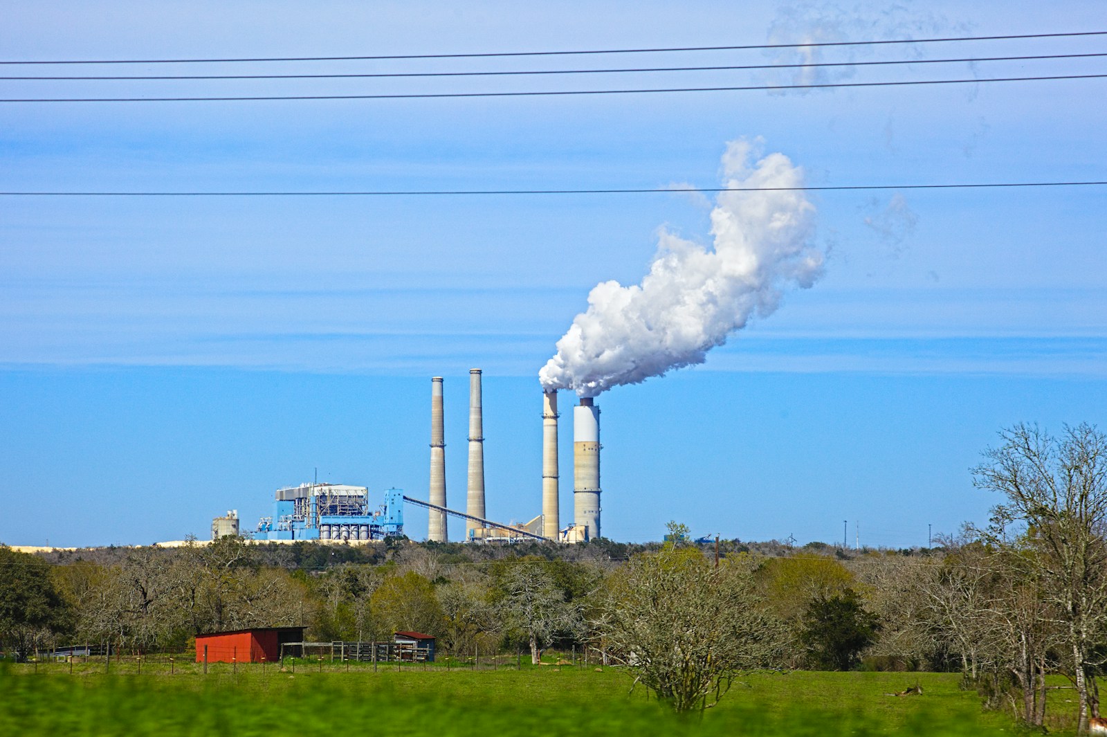Steam rising from a Texas power plant beside a lake