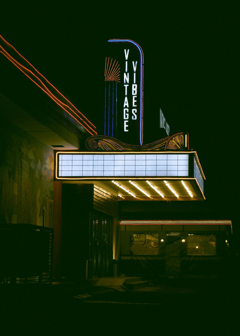 a theater marquee lit up at night