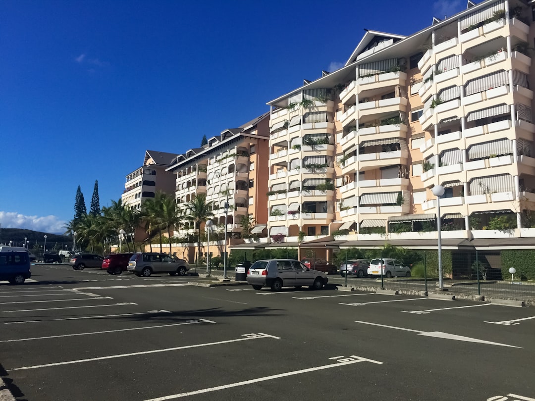 cars parked in front of building during daytime