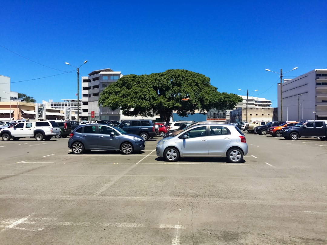 cars parked on parking lot during daytime