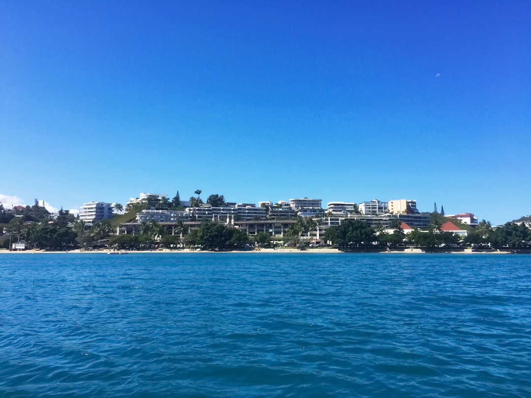 city buildings near body of water during daytime