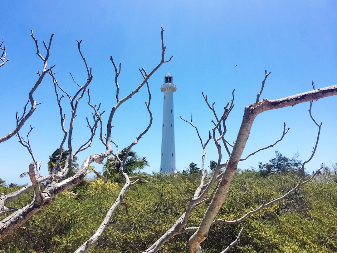white lighthouse under blue sky during daytime