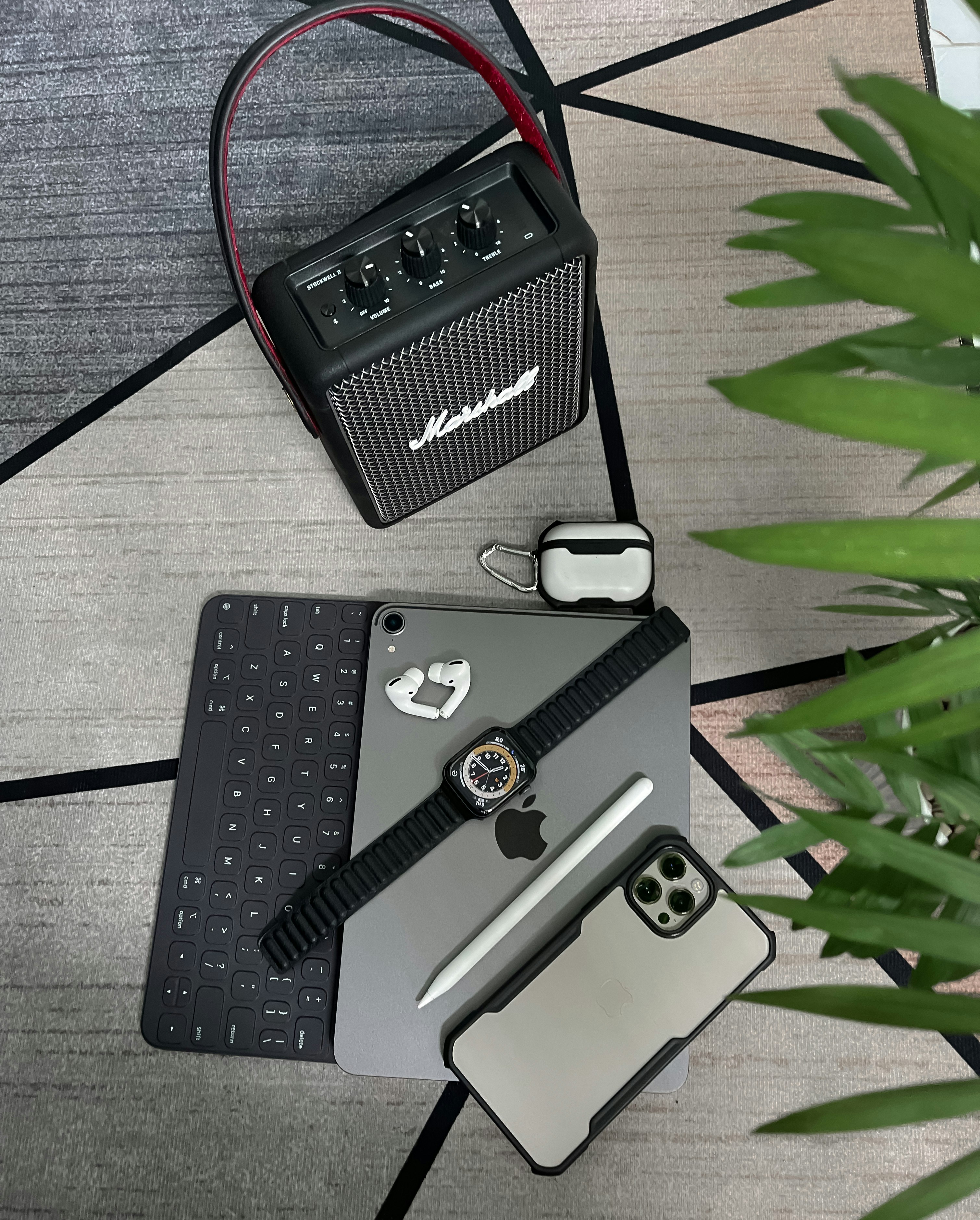 Electronics and gadgets arranged on dark surface with blue accent lighting