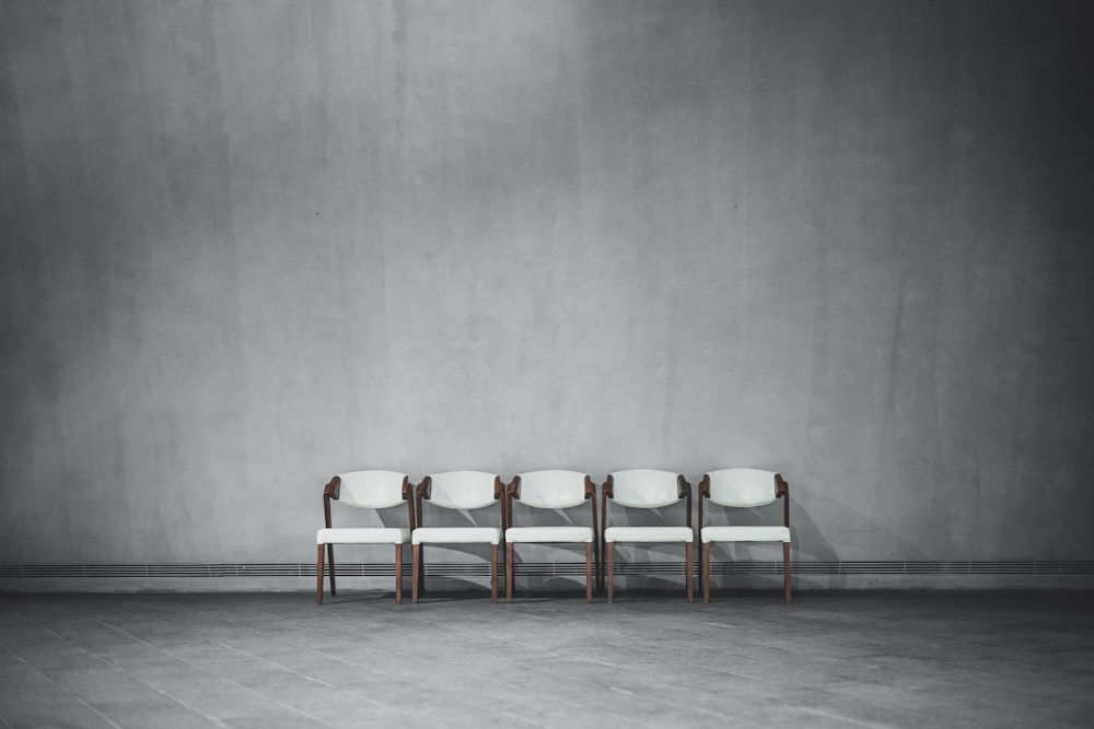 brown wooden chairs on gray floor