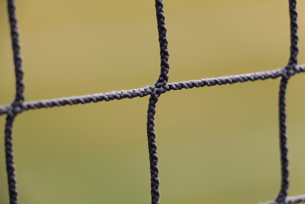 black metal fence in close up photography